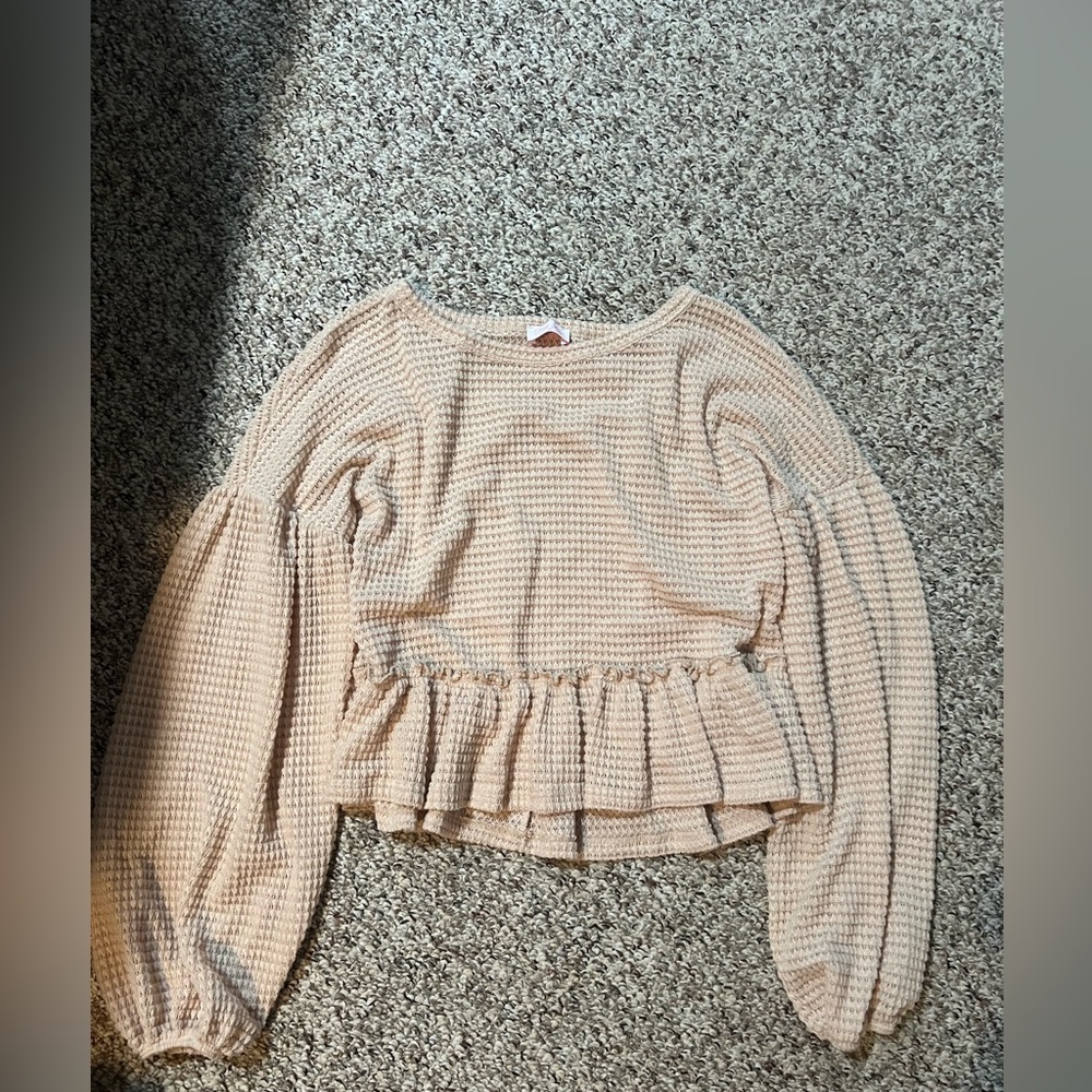 New trendy peplum style top.